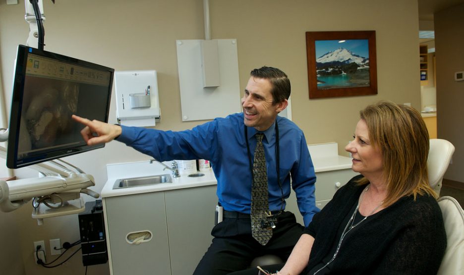 Our Tumwater Dentist at Gundersen Dental is working with his patient.